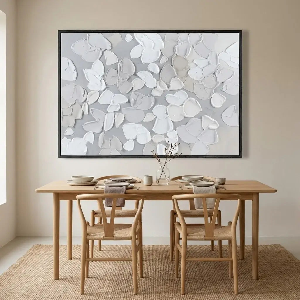 Dining room with wooden table and chairs, abstract art on the wall.