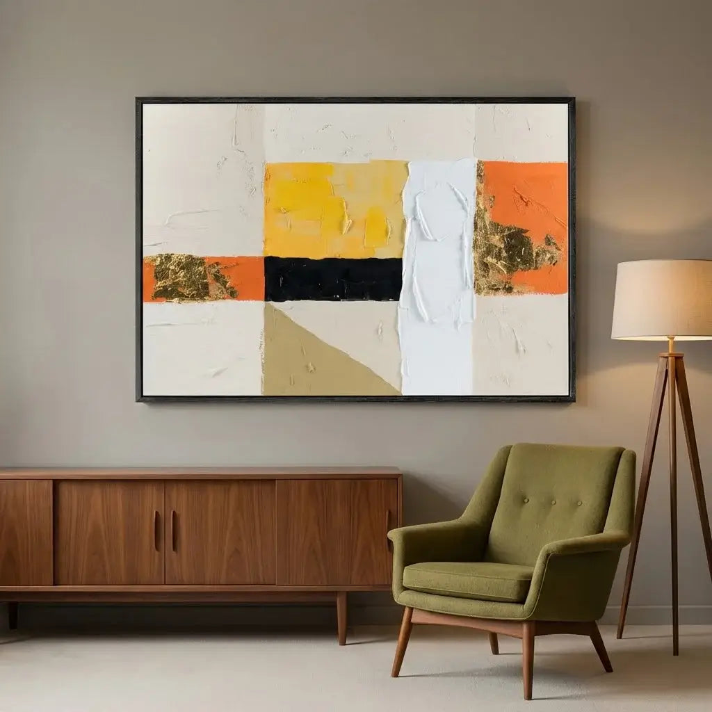 Modern living room with abstract art, wooden cabinet, and green armchair.