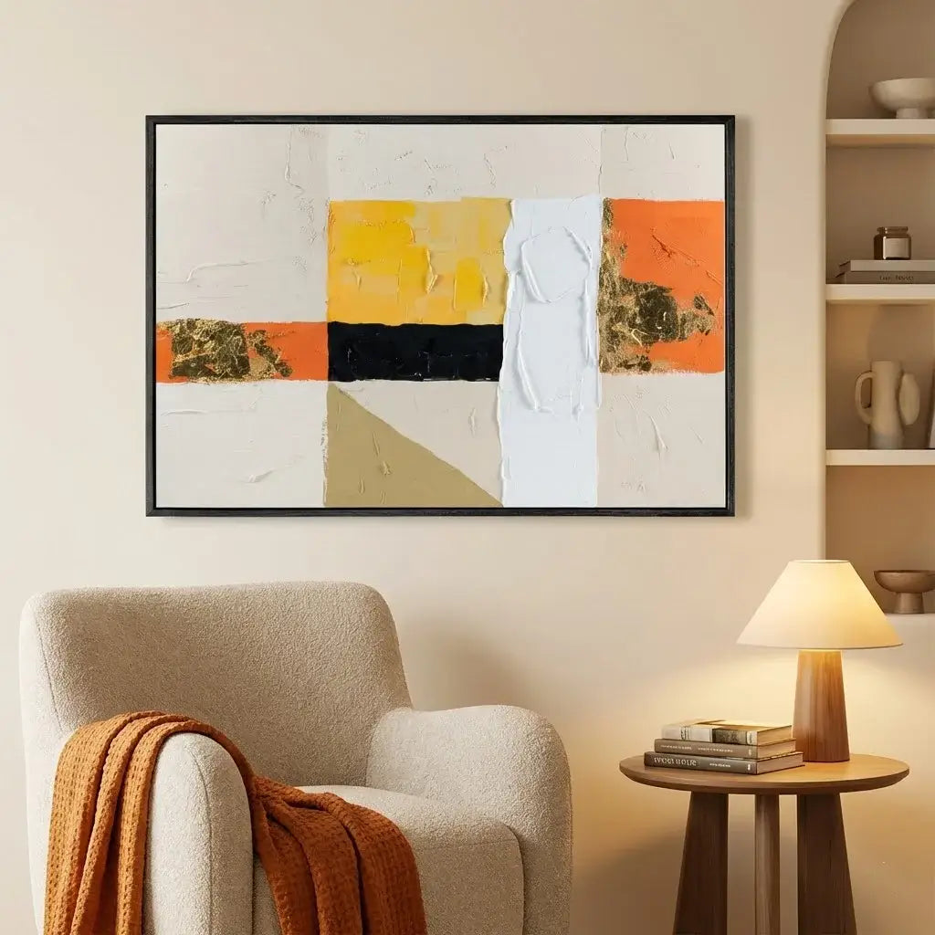 Abstract art piece on a wall above a chair in a living room setting.