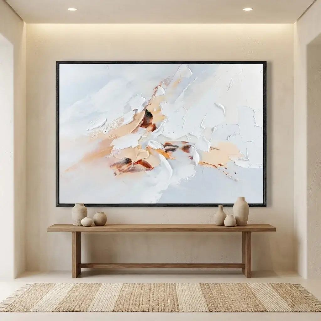 Abstract painting on a wall above a wooden bench in a room with neutral decor.