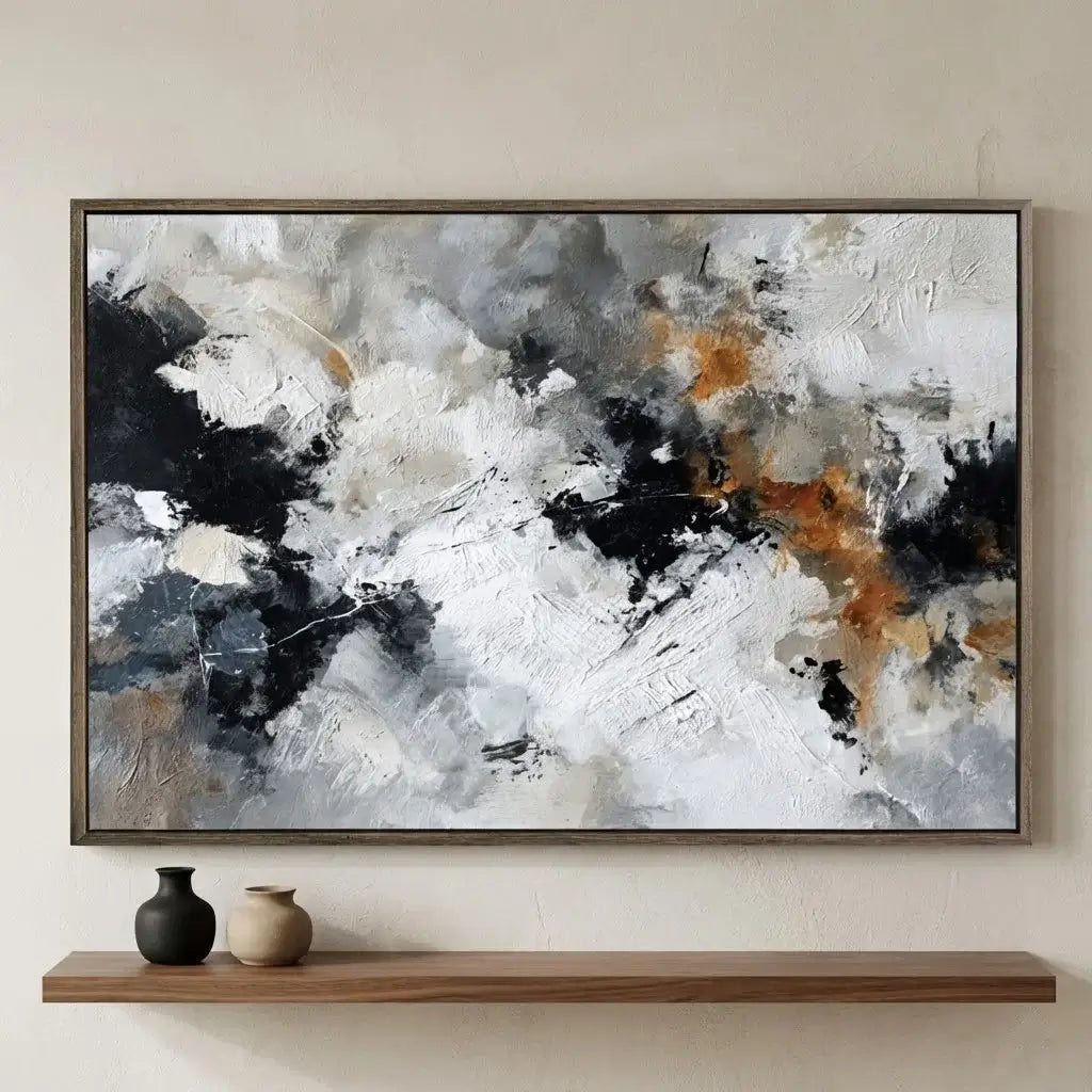 Abstract art painting in a wooden frame on a wall above a shelf with decorative vases.