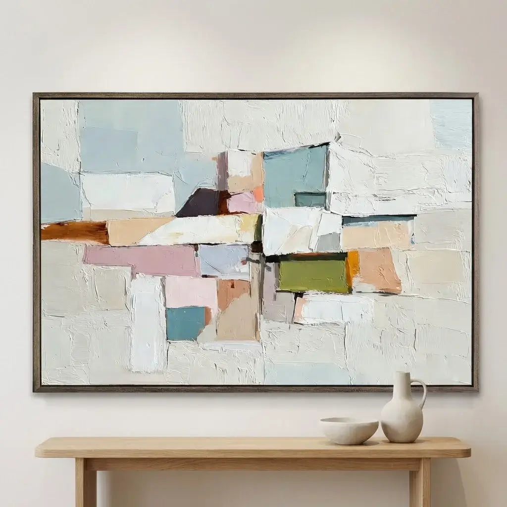 Abstract art piece in a modern interior setting with a console table and decorative items.