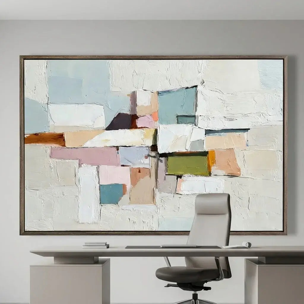 Abstract art piece in a modern office setting with a desk and chair.