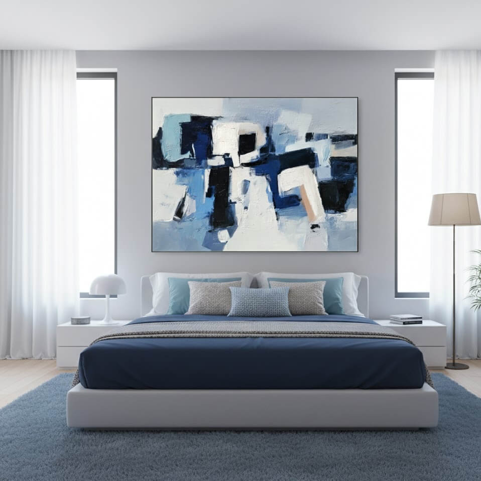Modern bedroom with abstract art above a bed