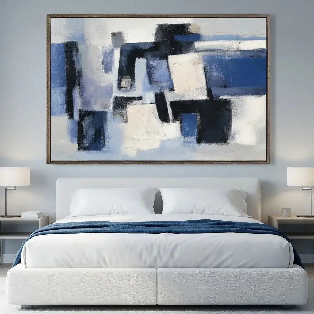 Modern bedroom with abstract art above a bed