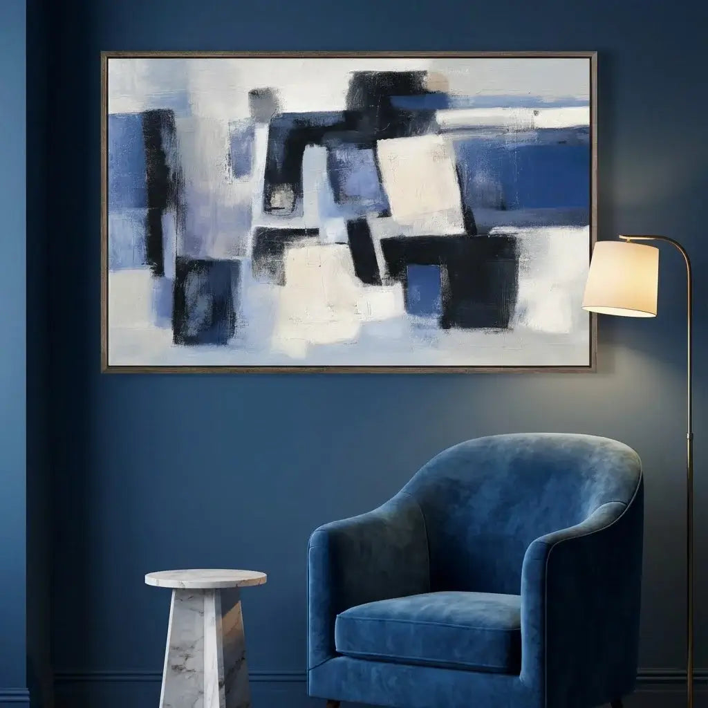 Abstract painting on a blue wall with a blue armchair and floor lamp.