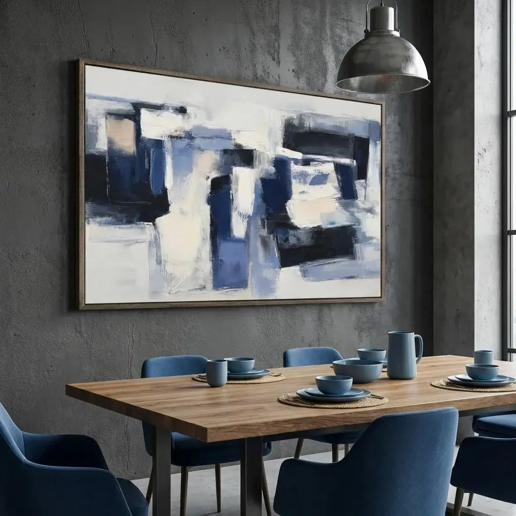 Dining room with abstract art on the wall, wooden table, and blue chairs.