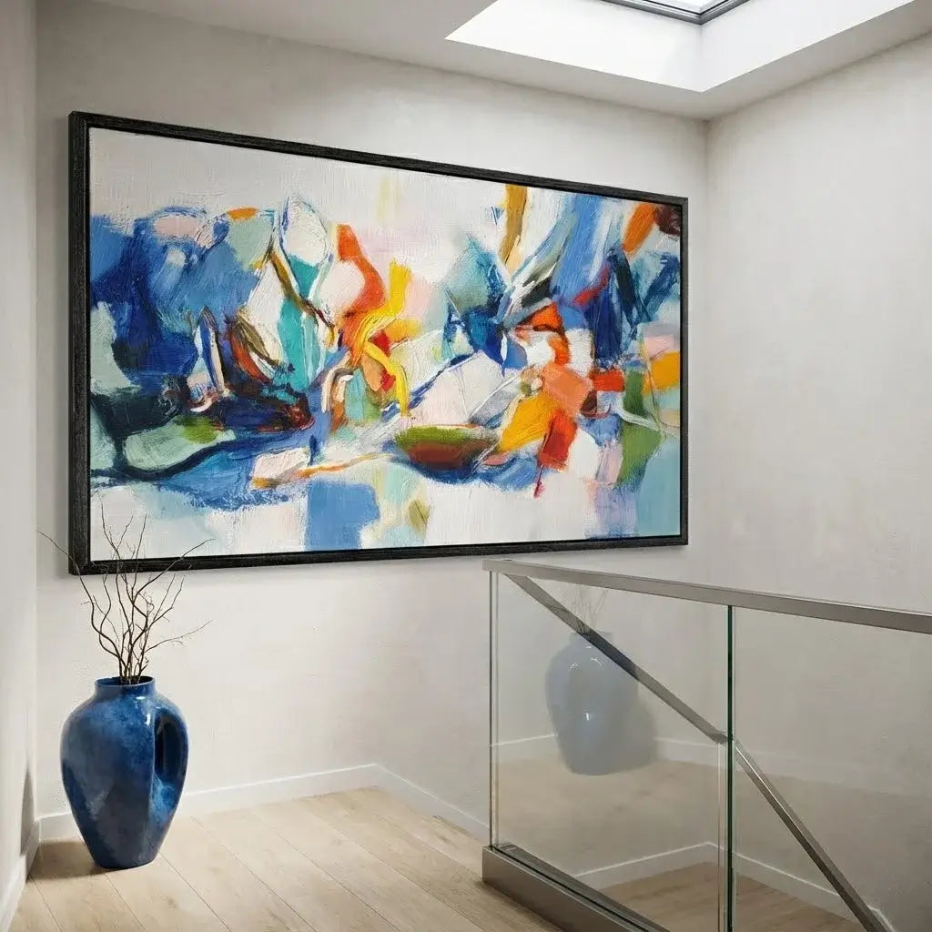 Modern interior with abstract painting, vases, and glass railing.