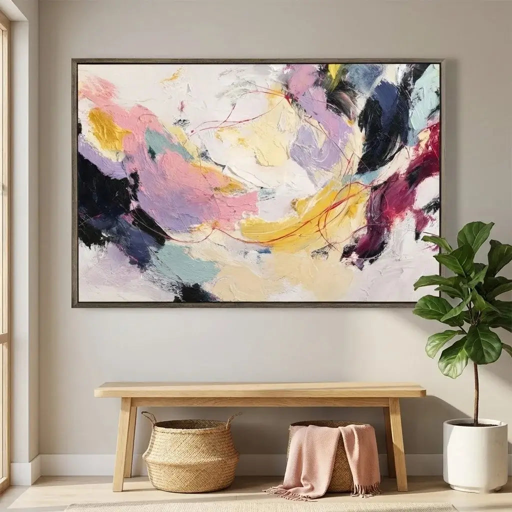 Abstract painting on a wall above a wooden bench with baskets and a plant.