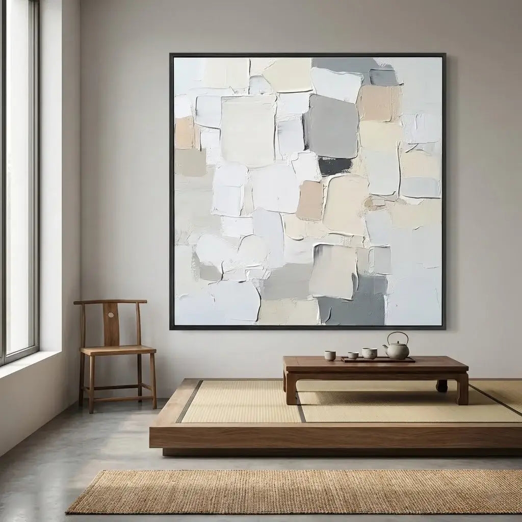 Modern interior with abstract art, wooden chair, and low coffee table.
