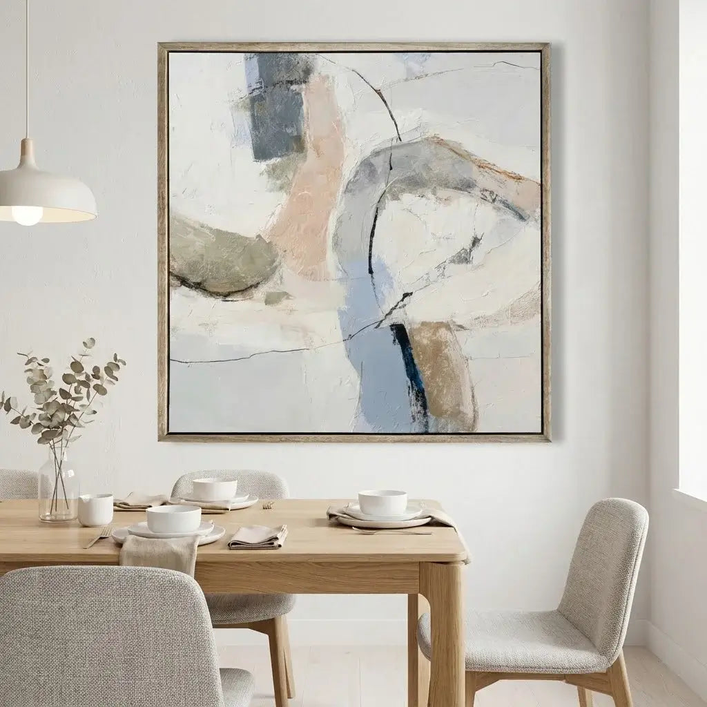 Dining room with a wooden table, chairs, and abstract art on the wall.