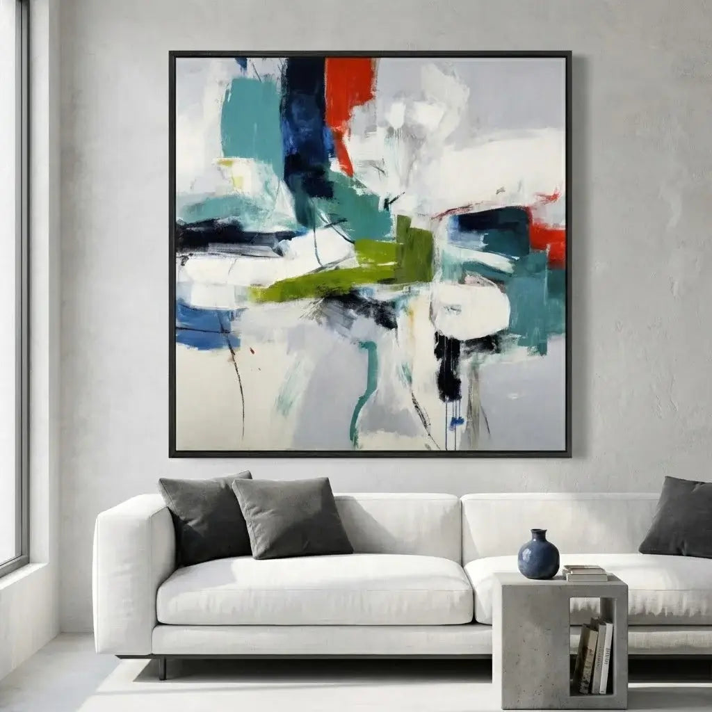 Abstract painting in a modern living room with a white sofa and decorative items.