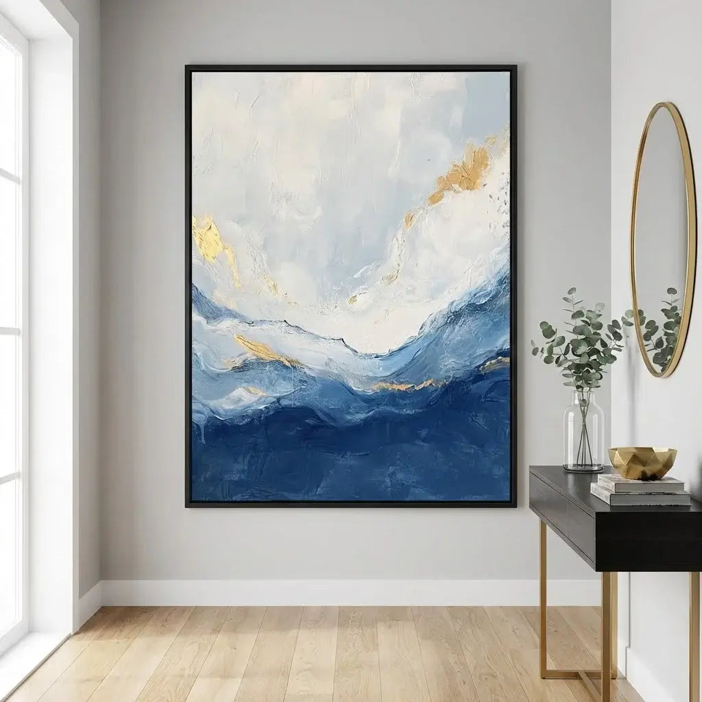 Abstract painting with blue and gold tones in a modern interior setting.