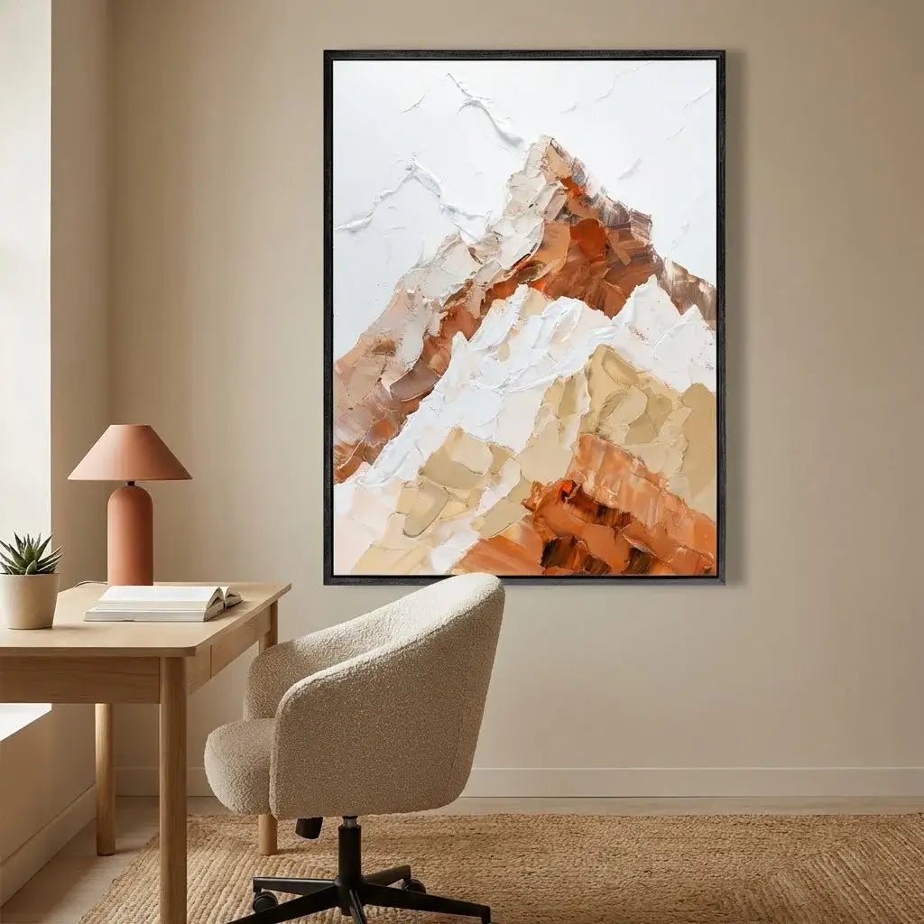 Abstract mountain art print in a modern office setting with a desk and chair.