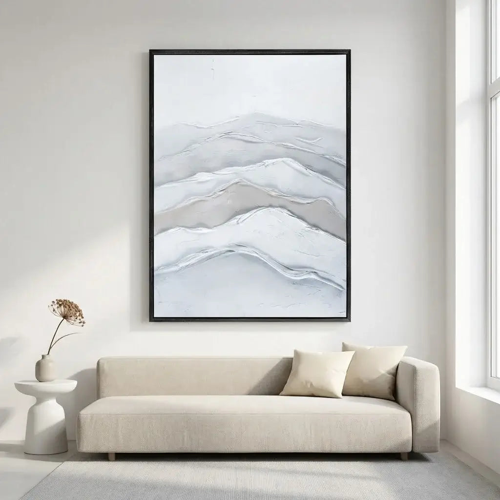 Abstract landscape painting in a modern living room with a beige sofa and side table.
