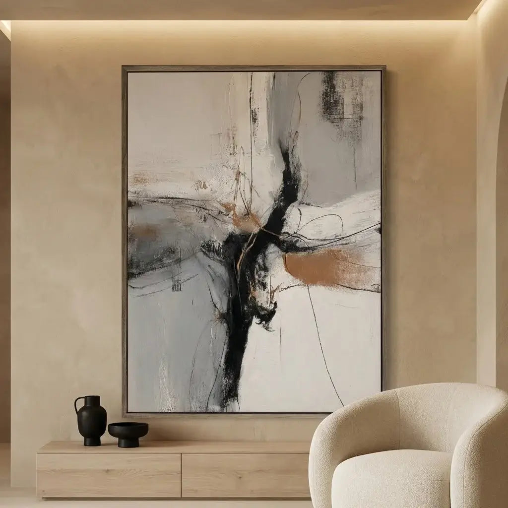 Abstract painting in a modern living room with a beige armchair and wooden cabinet.