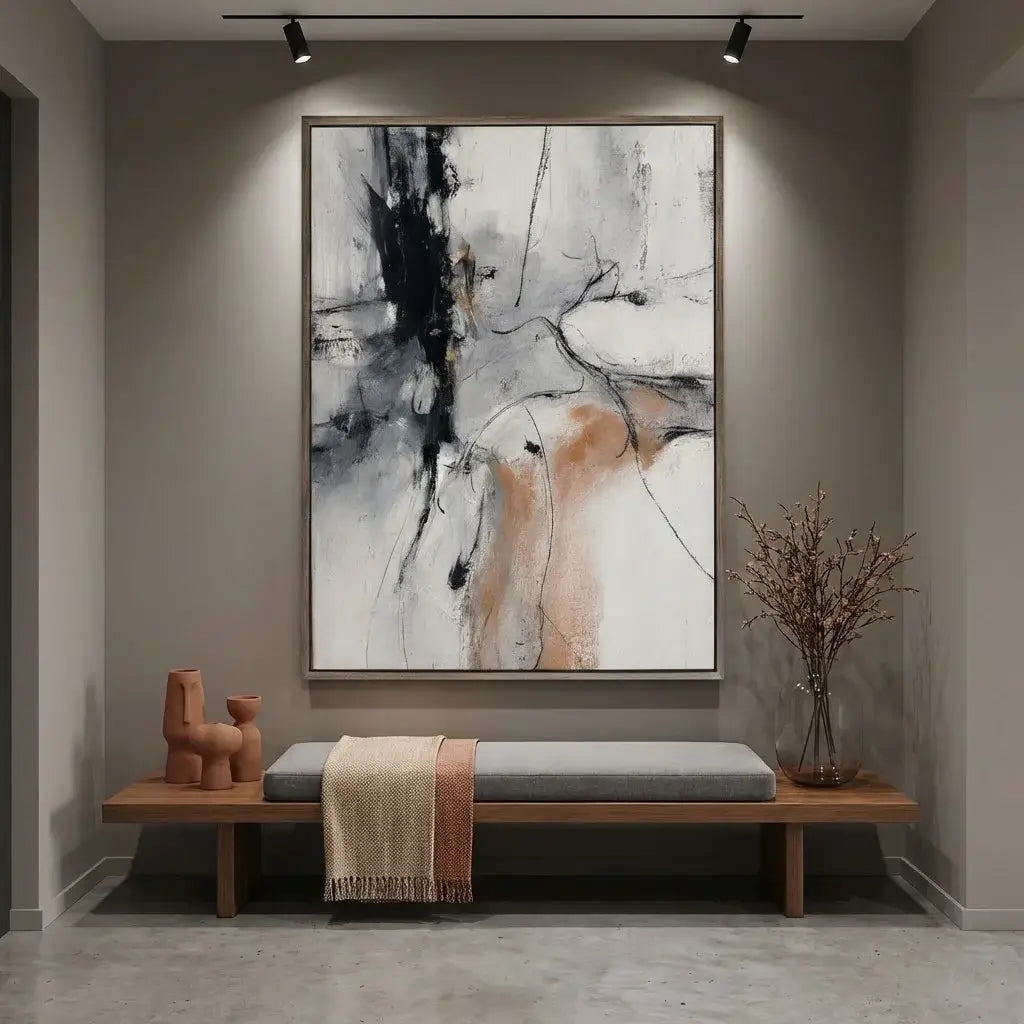 Abstract painting in a modern interior setting with a bench and decorative items.