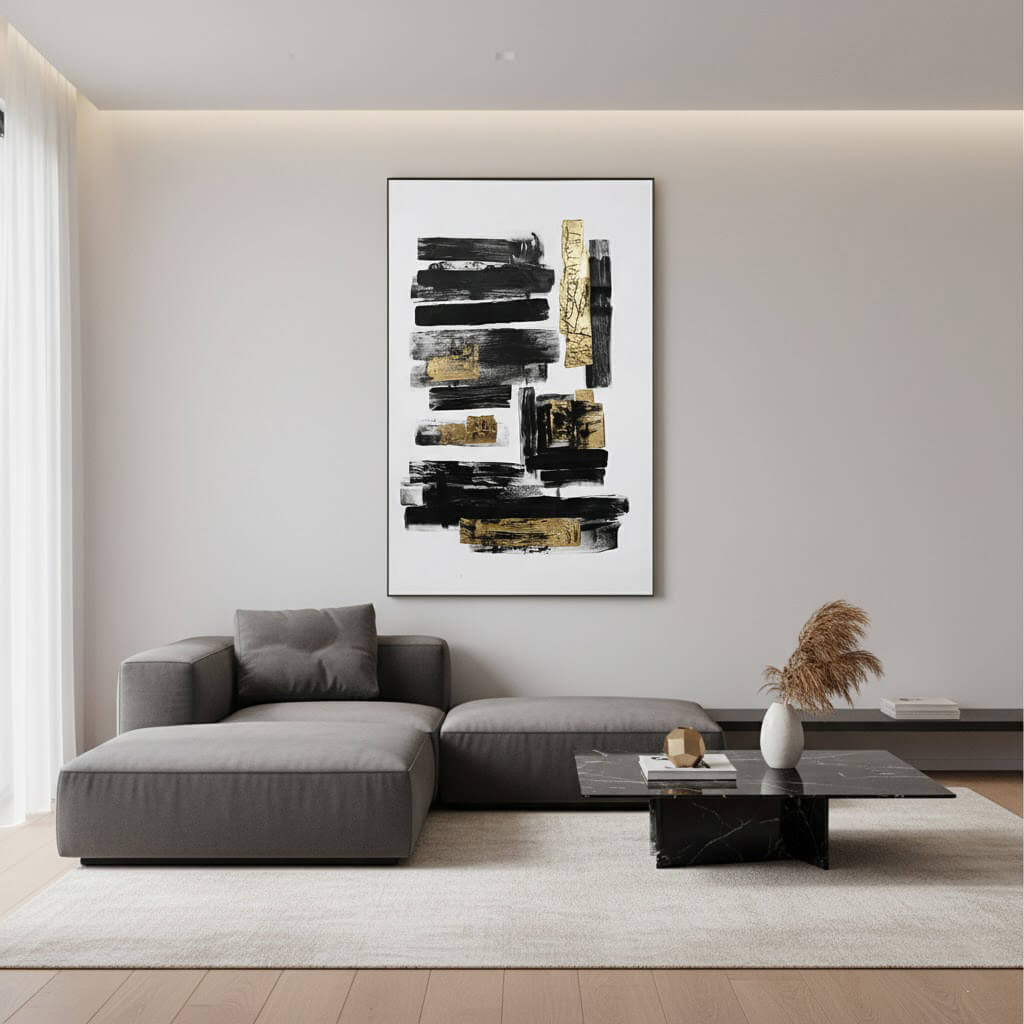 Modern living room with a gray sofa, abstract painting, and decorative items.