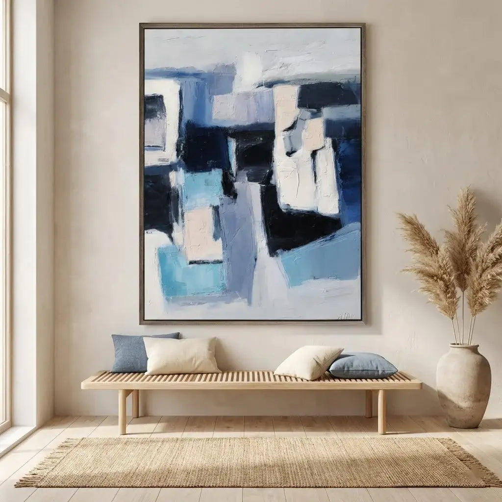 Abstract painting in a modern living room with a wooden bench and decorative elements.
