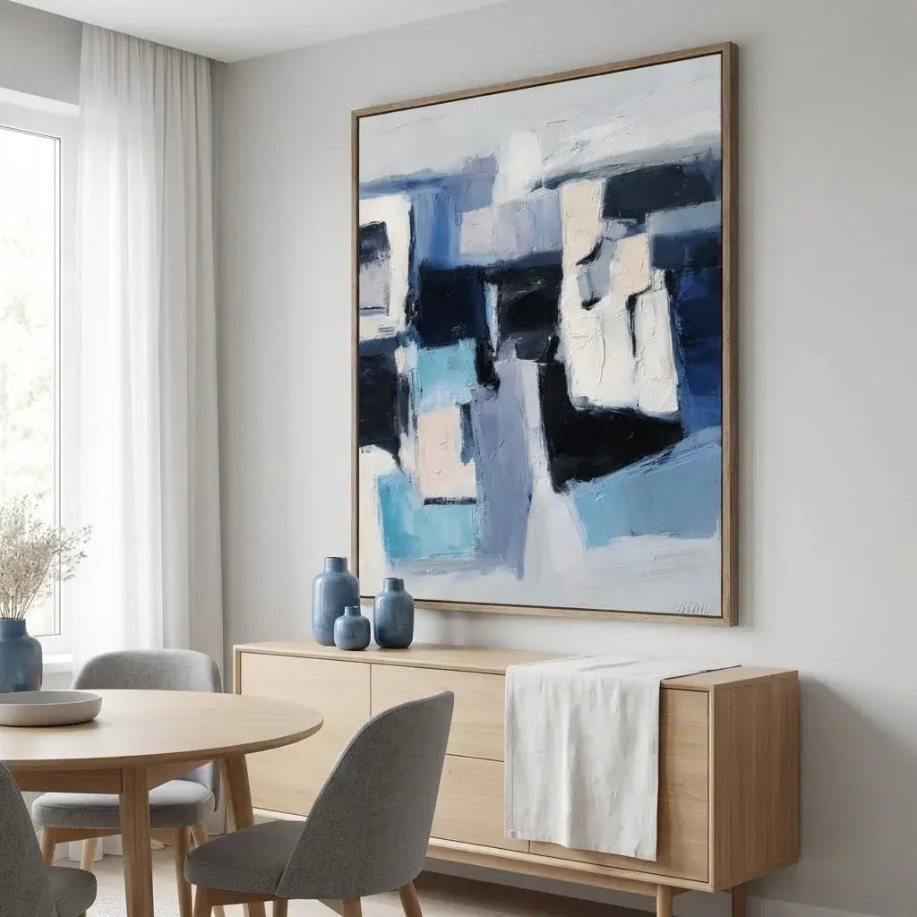 Modern interior with abstract art, wooden furniture, and decorative vases.