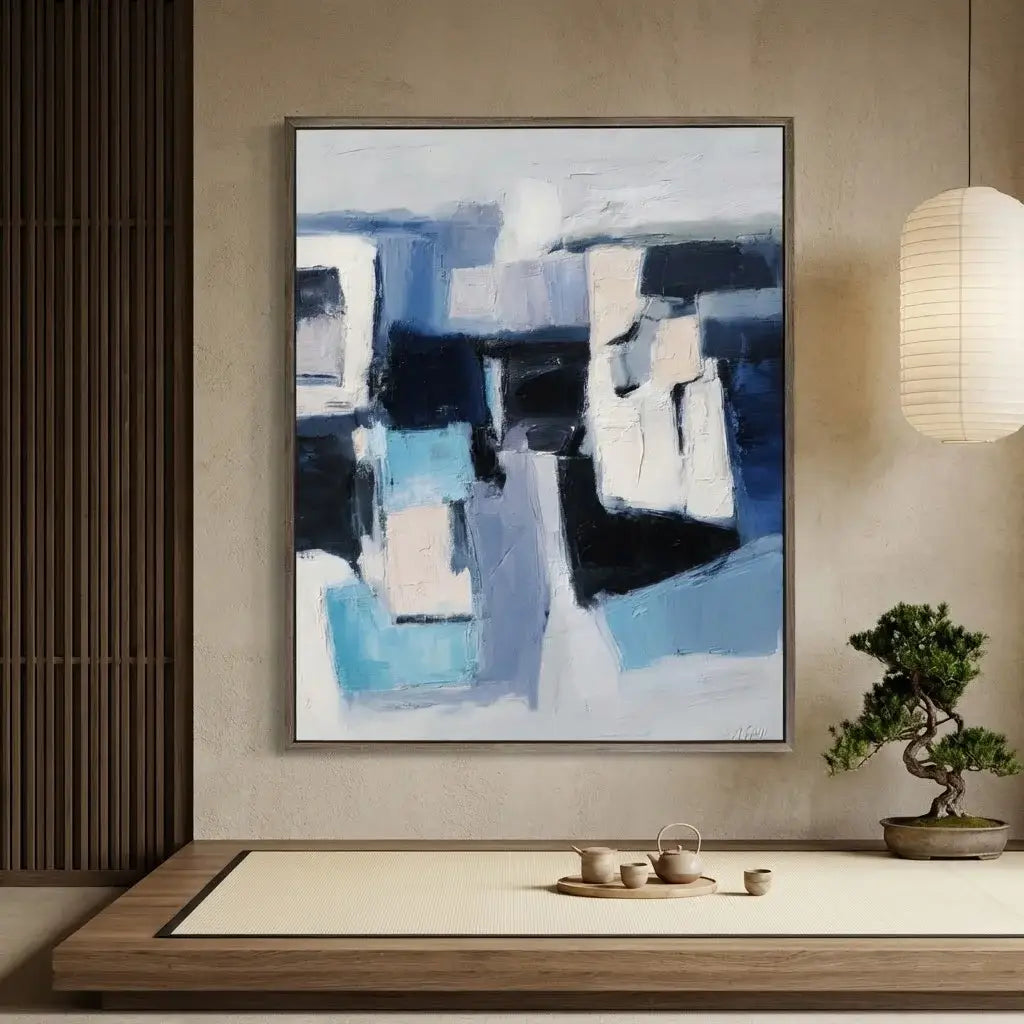 Abstract painting in a modern interior setting with a bonsai tree and tea set.
