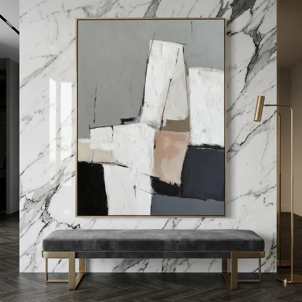 Abstract painting on a marble wall with a bench below