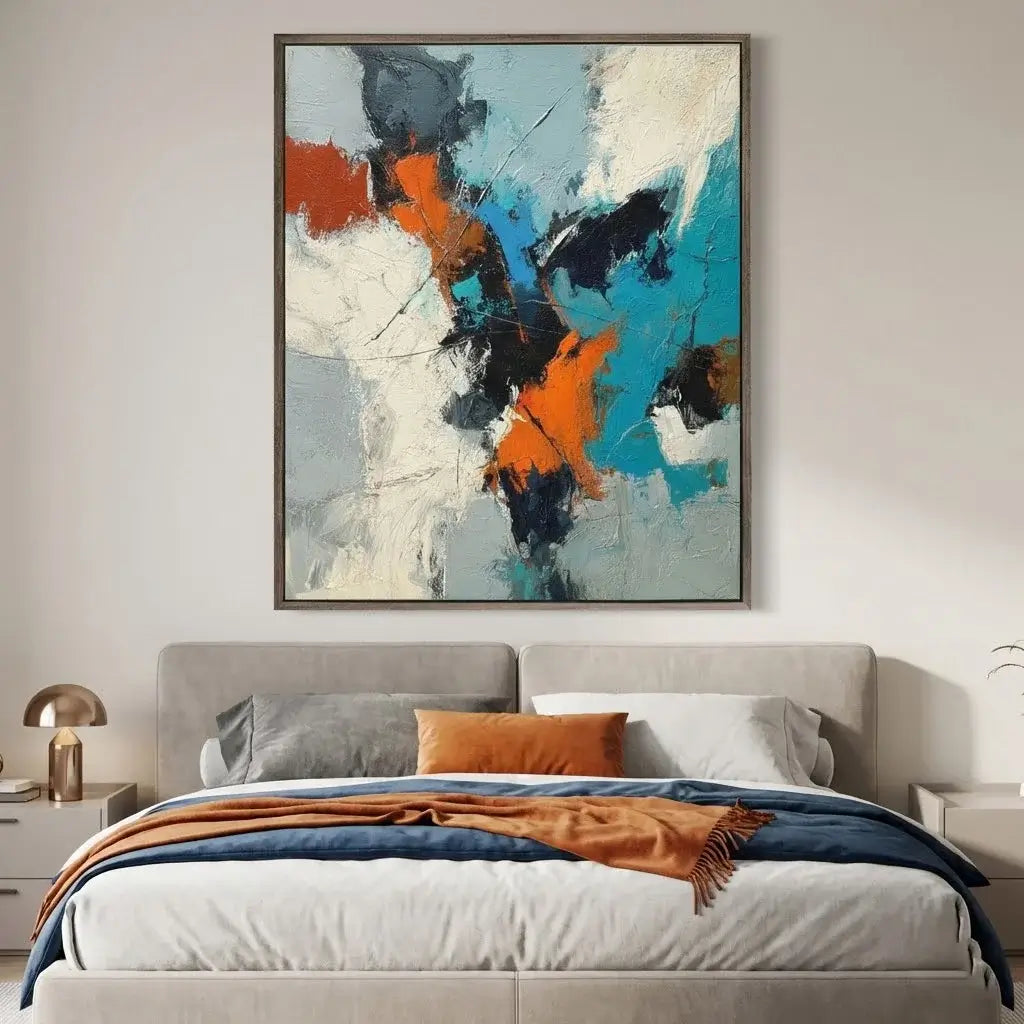 Abstract painting above a bed in a bedroom setting