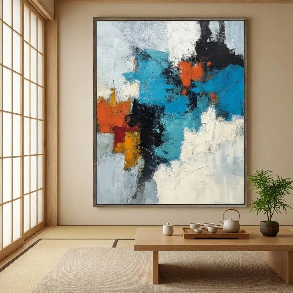 Abstract painting in a room with a wooden table and plant