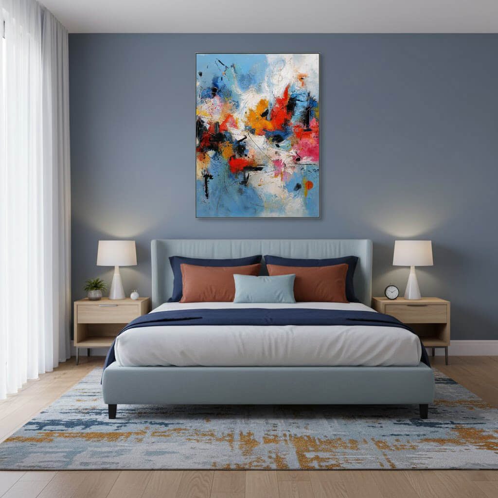 Modern bedroom with a bed, nightstands, lamps, and a colorful abstract painting on the wall.