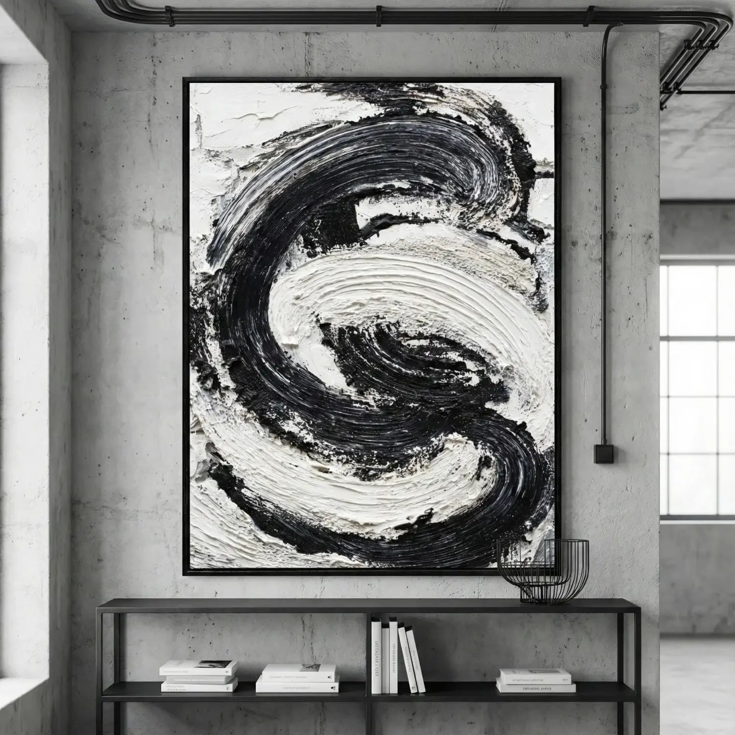 Abstract black and white painting on a wall in a modern interior setting.