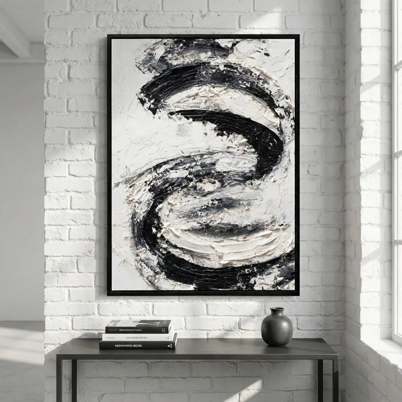 Abstract black and white painting in a modern interior setting.