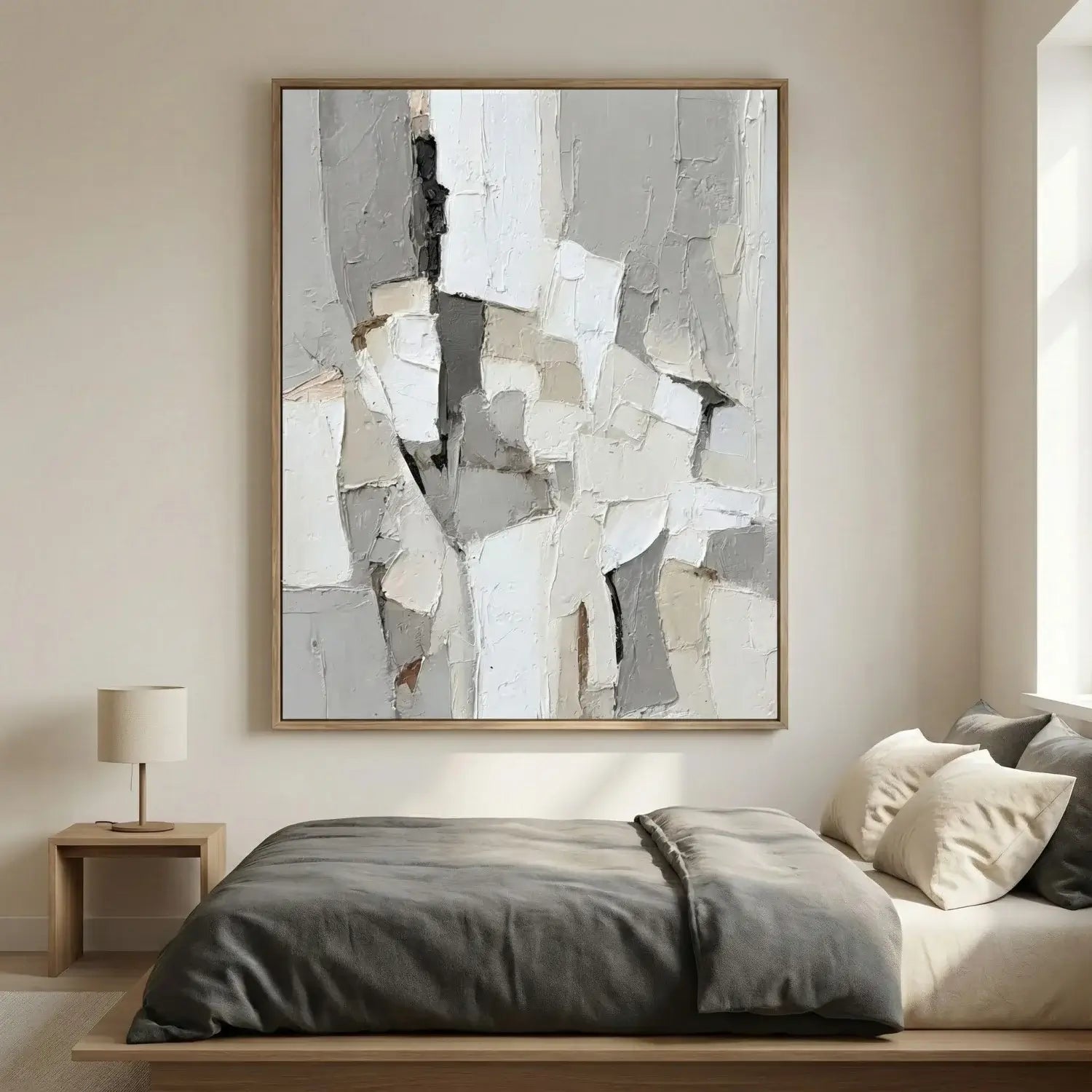 Abstract art piece on a wall above a bed in a bedroom setting
