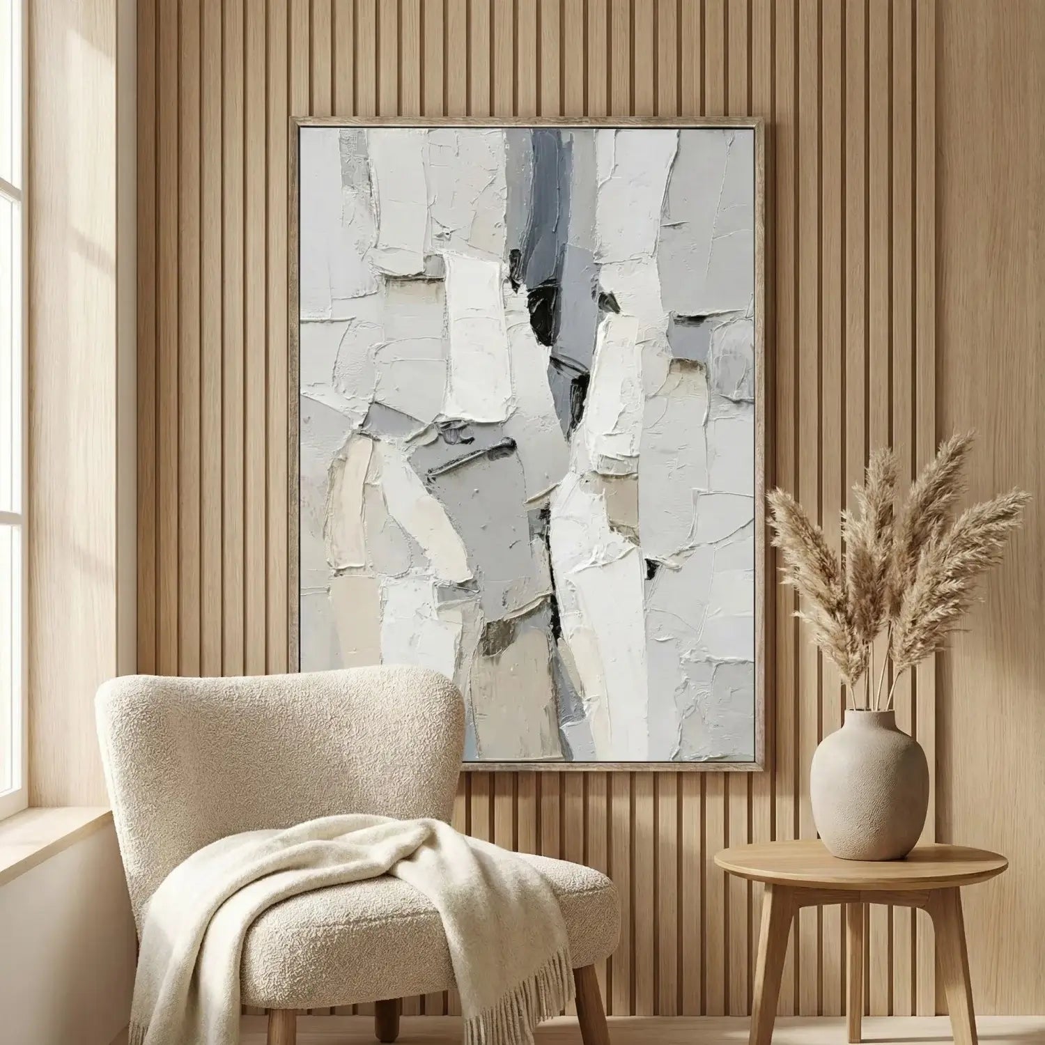 Modern interior with abstract art, chair, and side table.