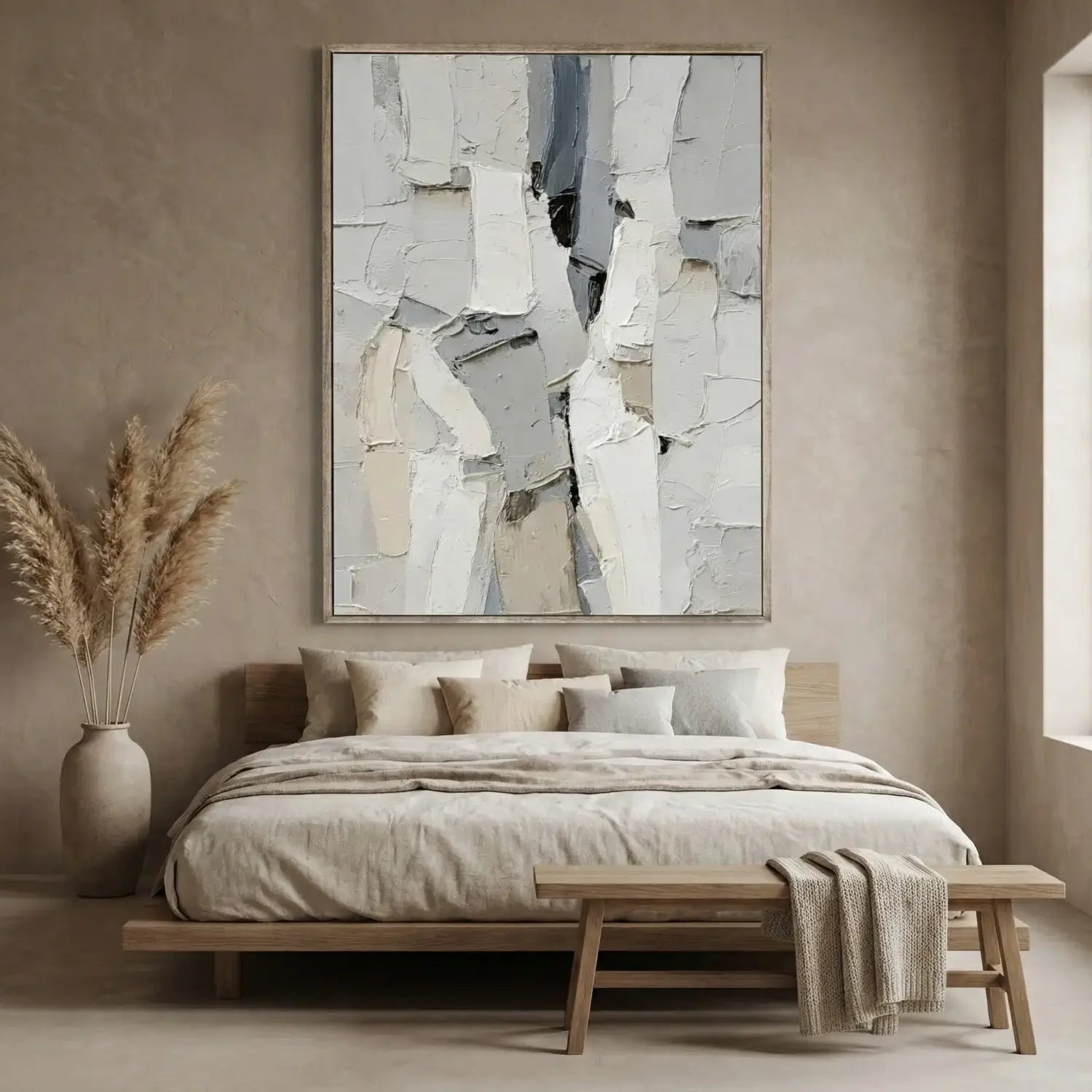 Modern bedroom with abstract art, bed, and decor elements.
