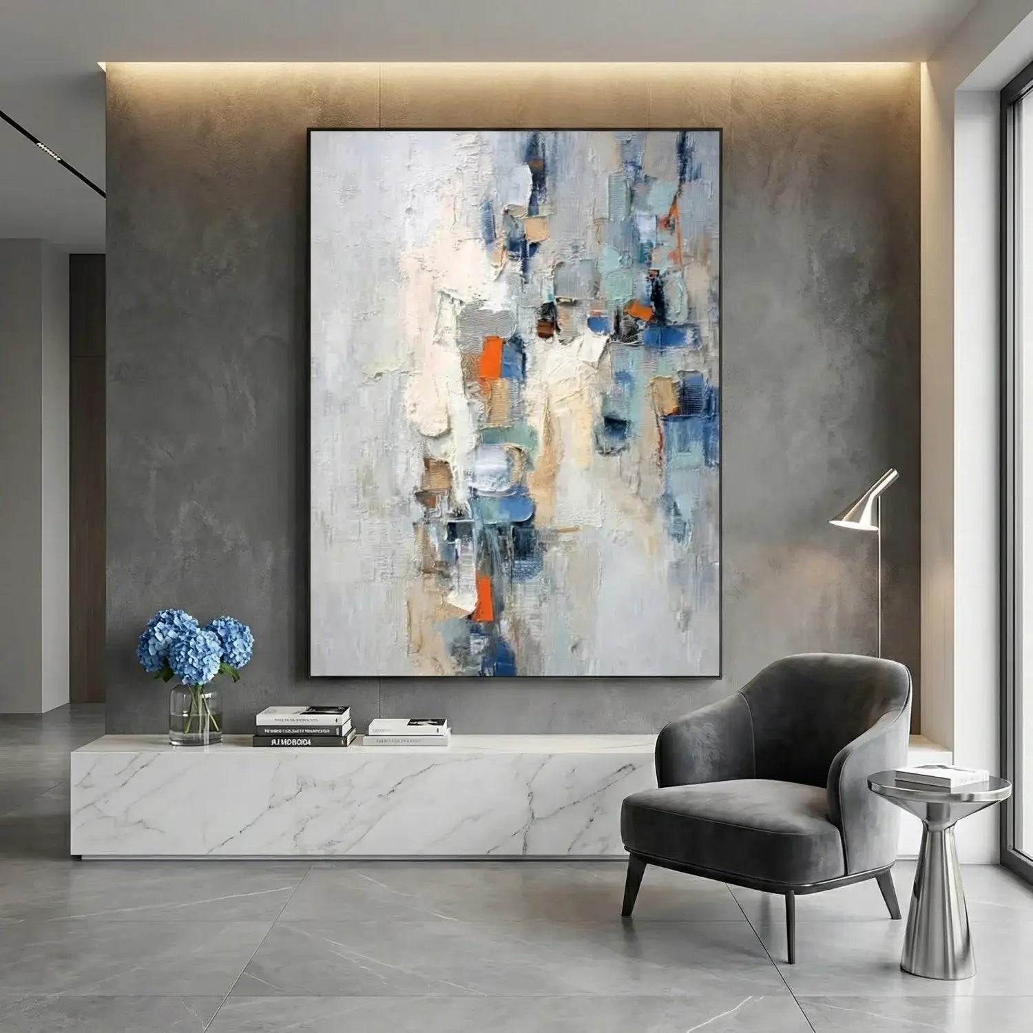 Modern interior with abstract painting, gray chair, and marble console table.