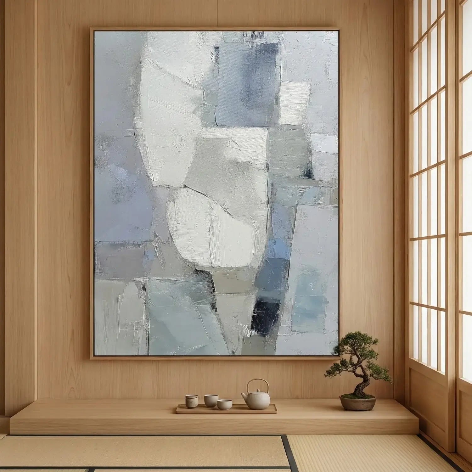 Abstract art piece in a room with wooden walls and a bonsai tree.