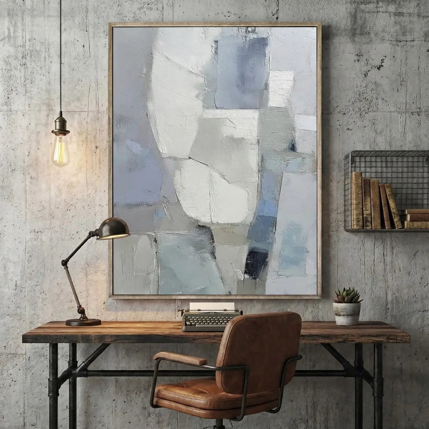 Modern office setup with a wooden desk, leather chair, lamp, and abstract art on a concrete wall.