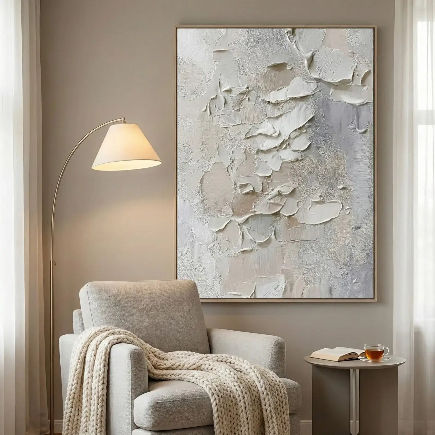 Living room with a gray armchair, abstract painting, and floor lamp.