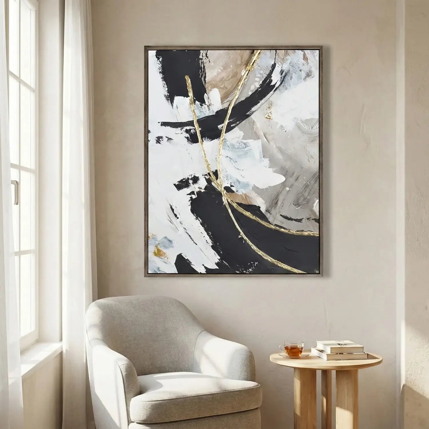 Abstract art piece on a wall above a chair in a room with natural light.