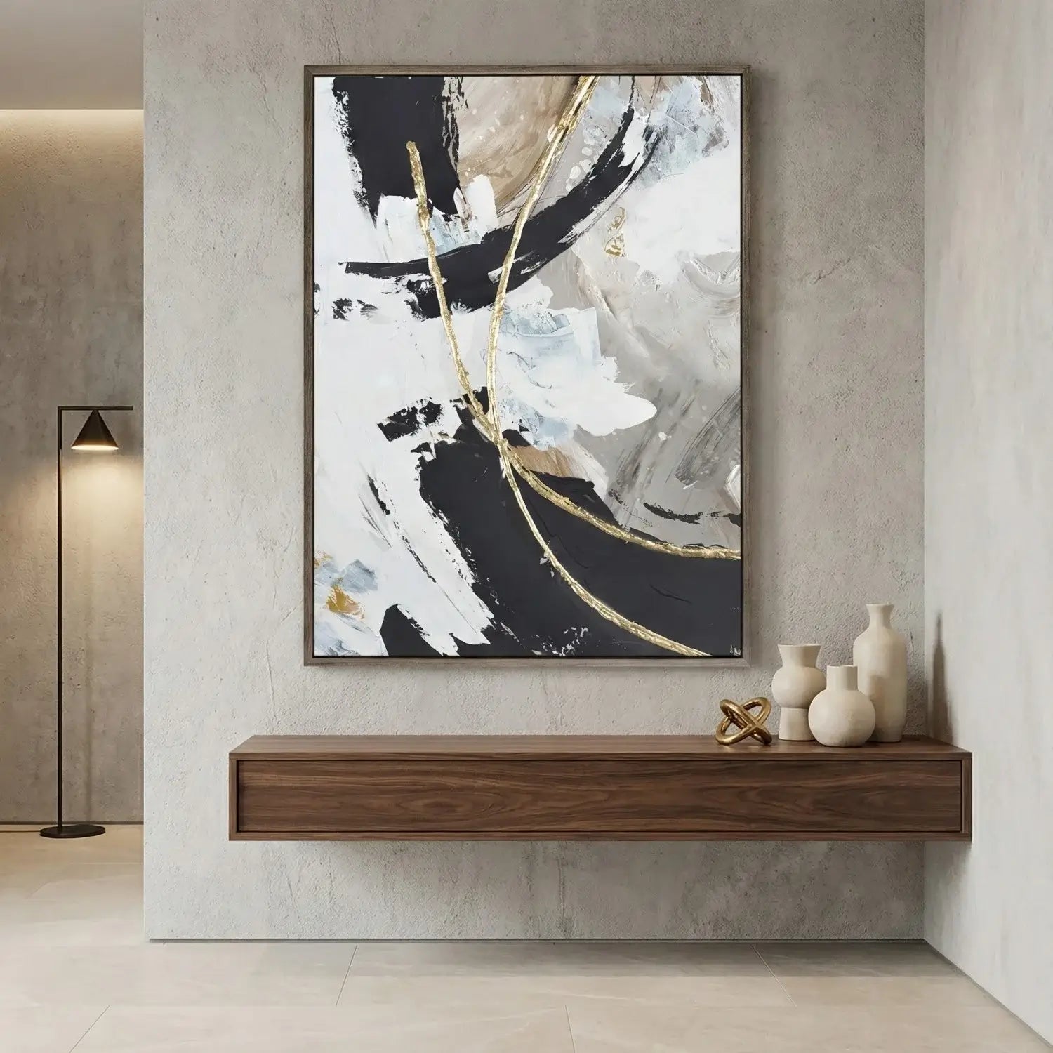 Abstract art piece on a wall above a wooden shelf with decorative items.