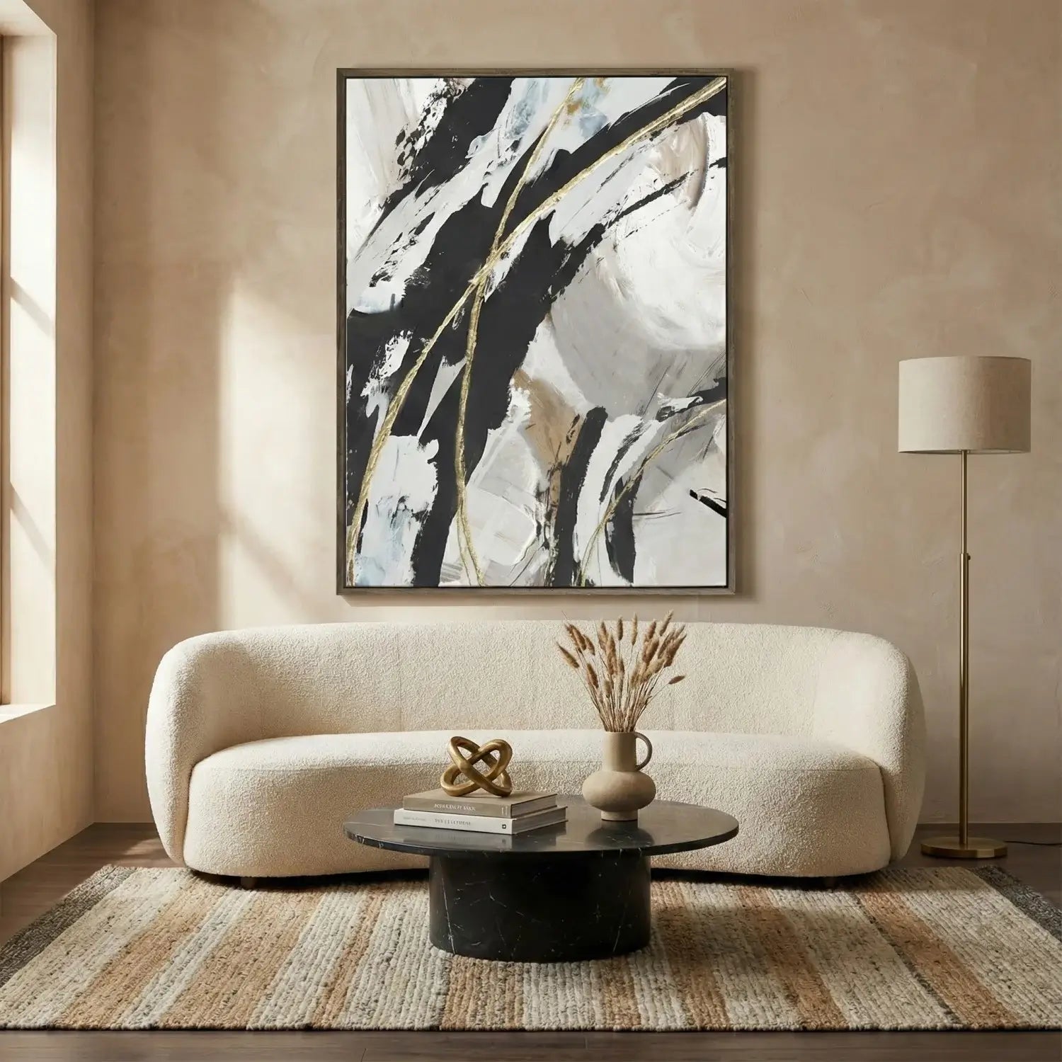 Modern living room with abstract art, sofa, and coffee table.