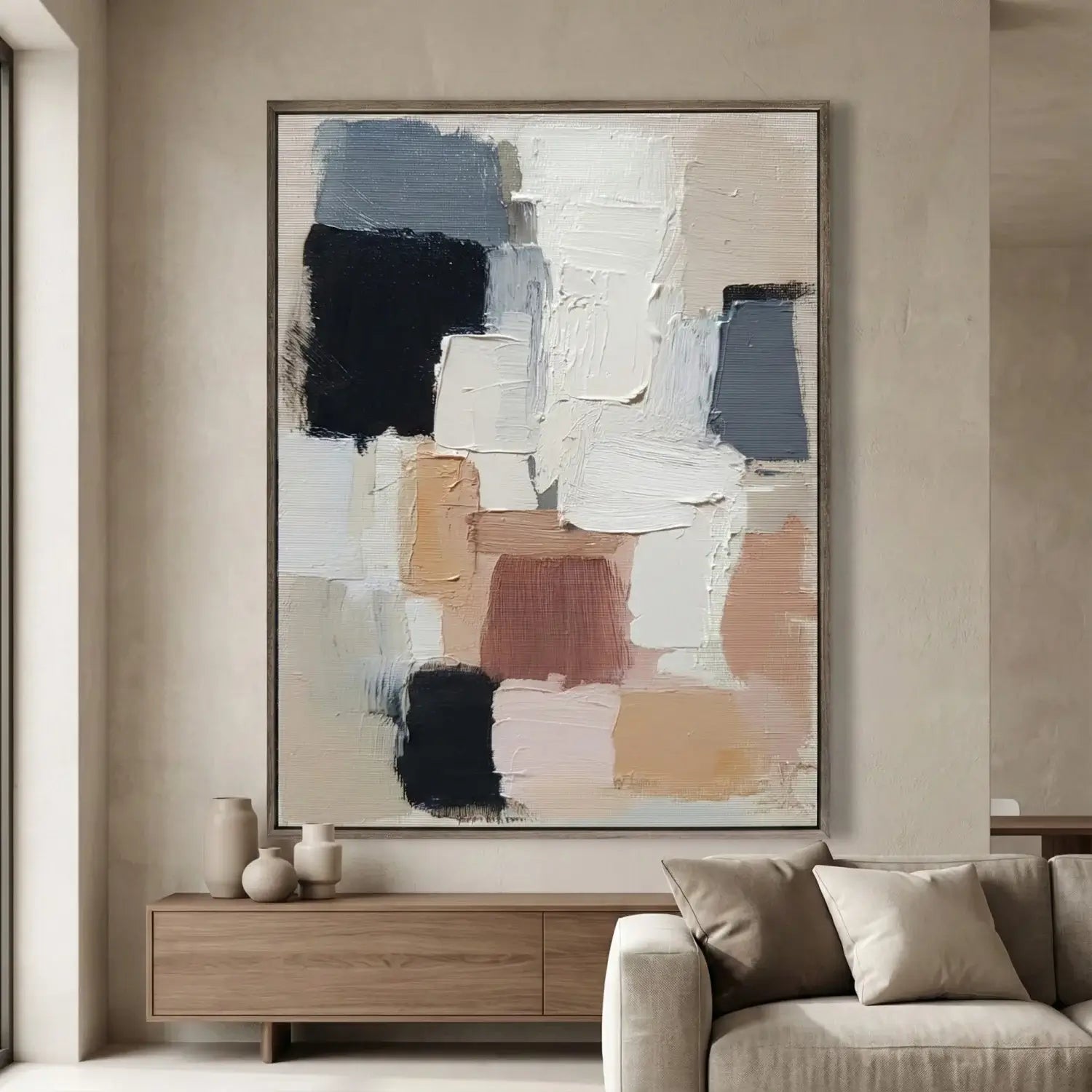 Abstract art piece on a wall in a living room setting
