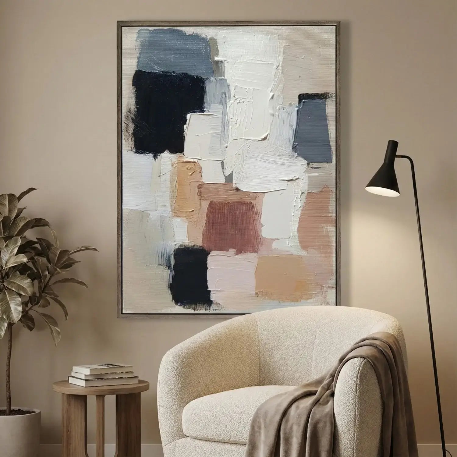 Abstract art piece on a wall above a beige armchair in a living room setting.