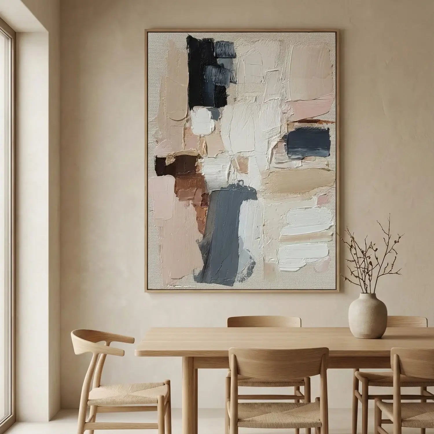 Dining room with abstract art on the wall, wooden table, and chairs.