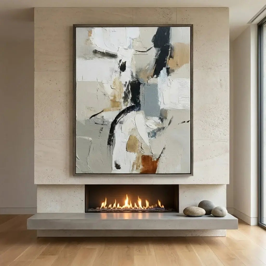 Abstract painting above a modern fireplace in a room with wooden flooring.