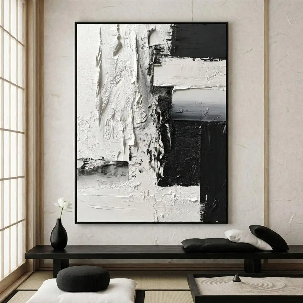Abstract black and white painting on a wall in a modern interior setting.