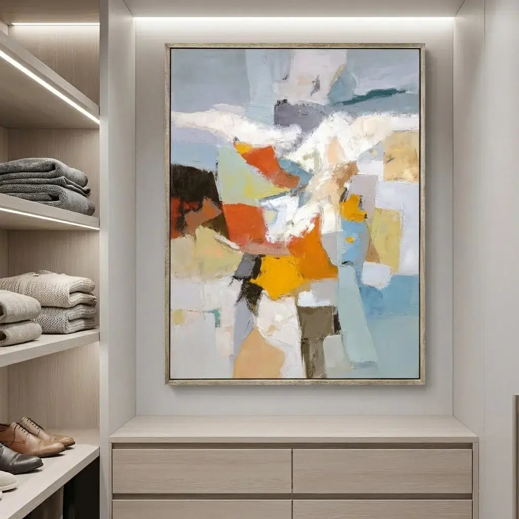 Abstract art piece on a wall in a room with shelves and shoes.