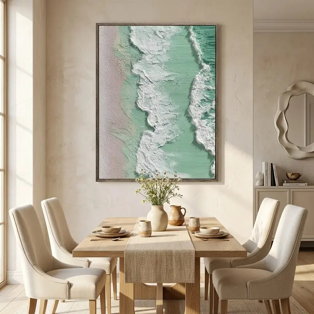 Dining room with a wooden table set for a meal, beige chairs, and a large framed artwork on the wall.