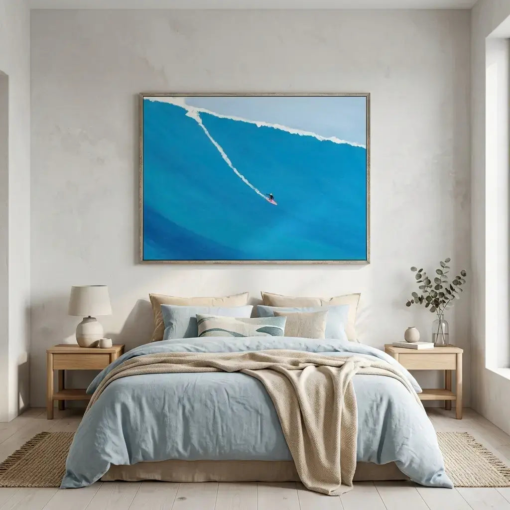 Modern bedroom with a large abstract painting of a blue wave on the wall.