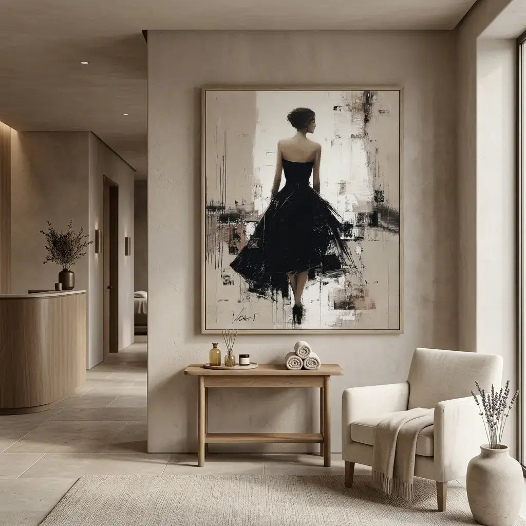 Modern interior with a large framed artwork of a woman in a black dress on a wall.